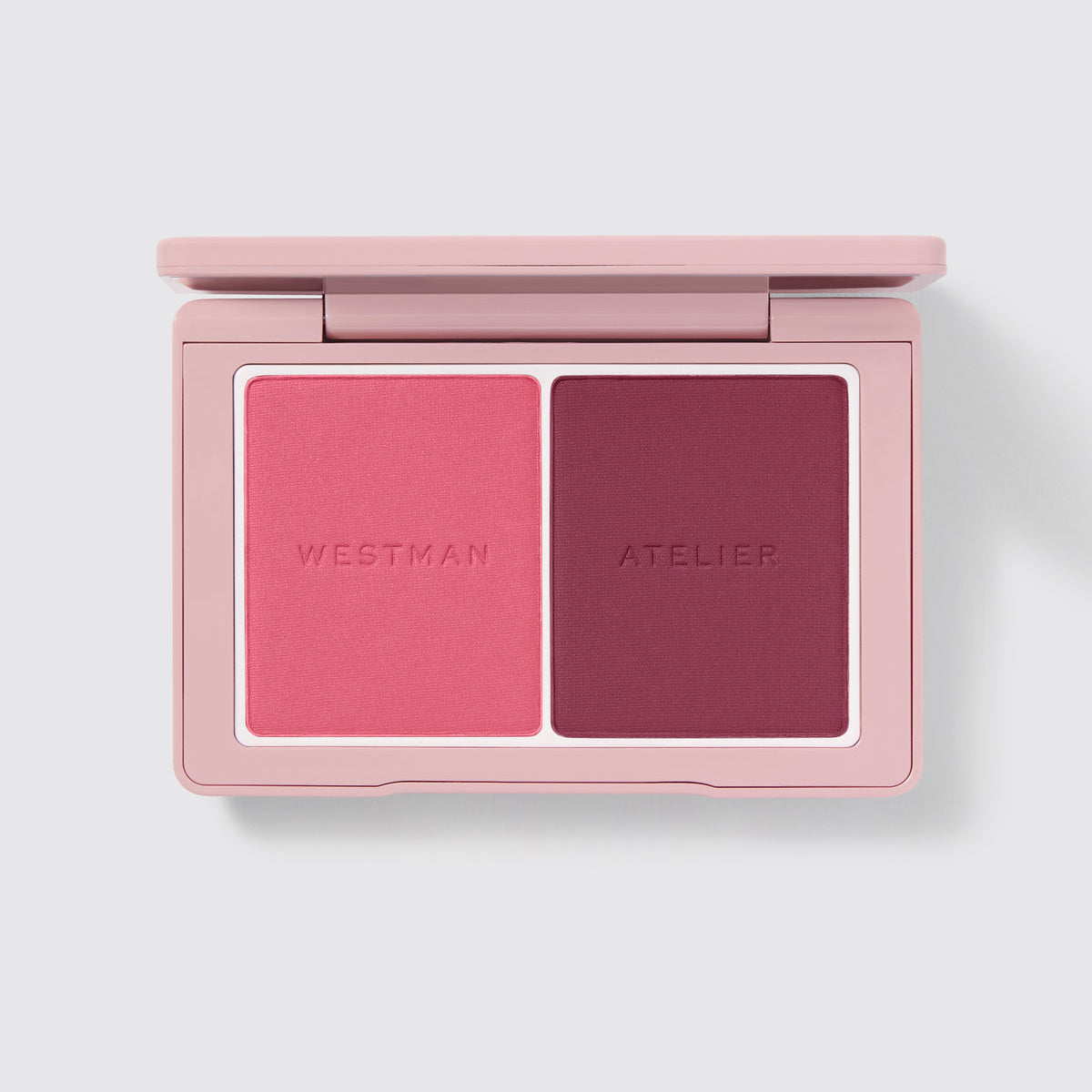 Westman Atelier Powder Duos featuring a vibrant pink and deep plum shade for versatile makeup looks