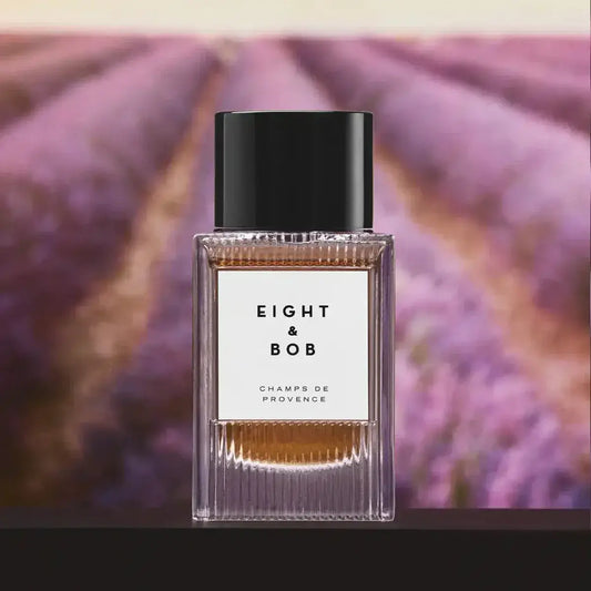 Perfume bottle with 'Eight & Bob' label against a lavender field background