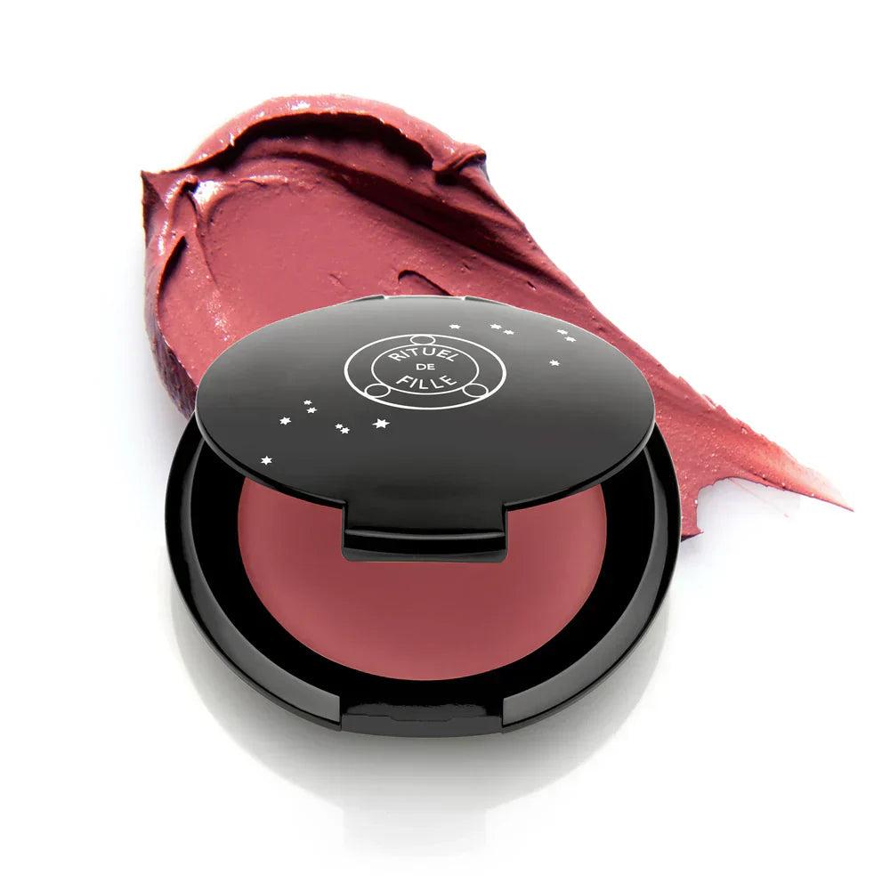Rituel de Fille Cream Blush in a sleek black compact with a rich berry color swatch