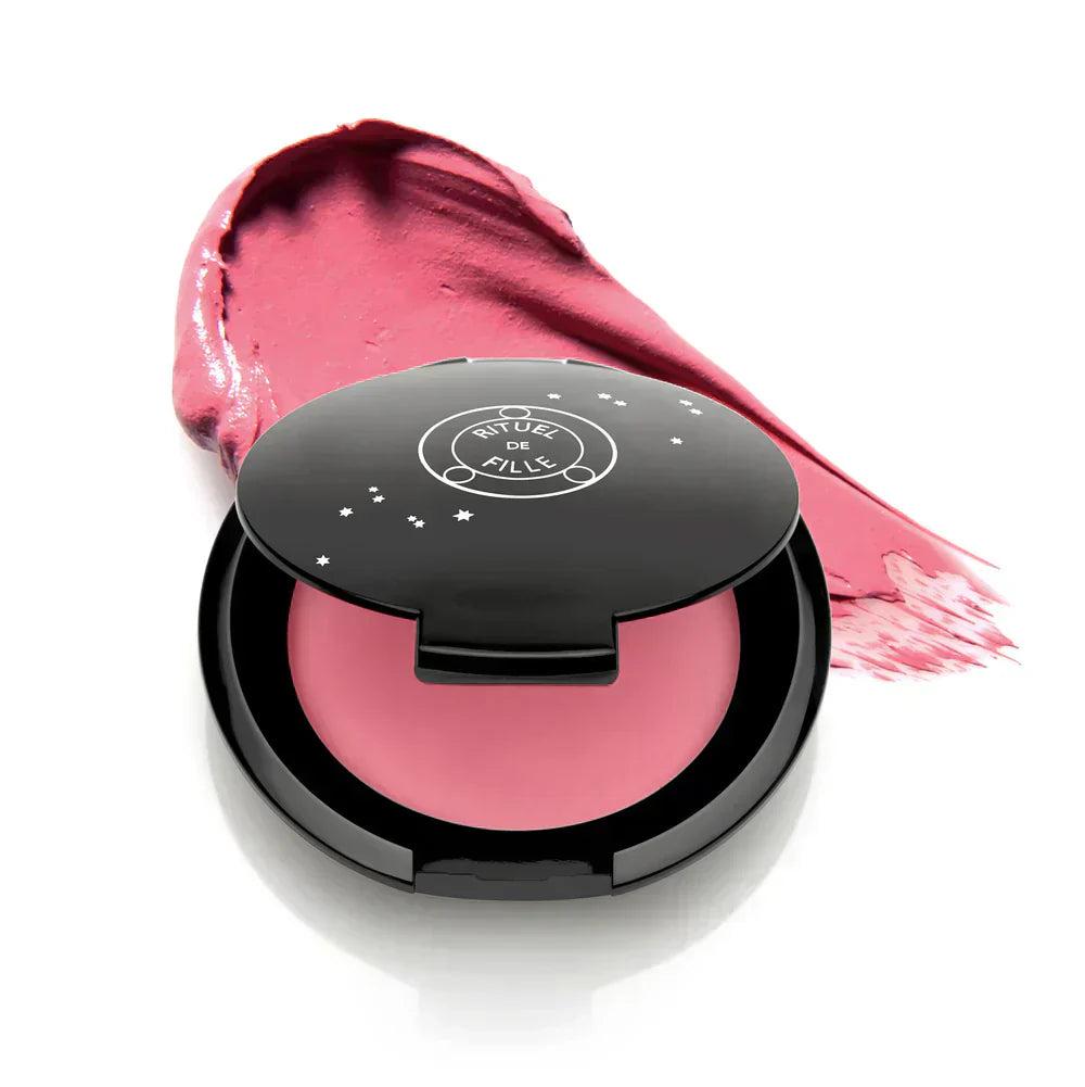 Rituel de Fille Cream Blush in a sleek black compact with a swatch of pink color