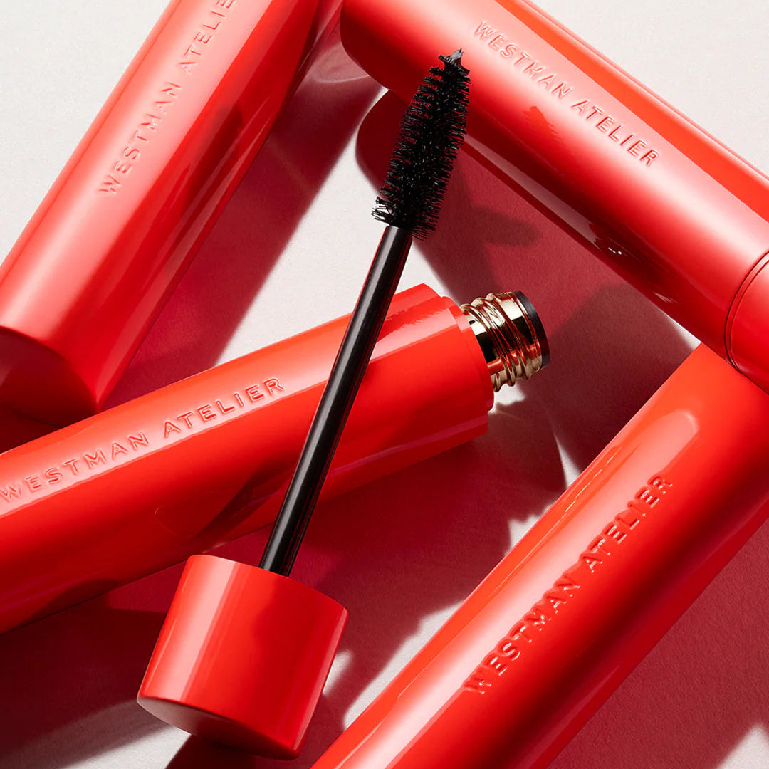 Westman Atelier Buildable Mascara in bold red packaging with a brush applicator for eye enhancement