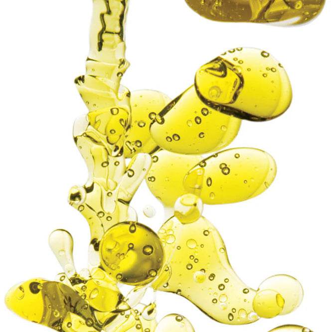 Close-up of golden oil droplets texture for Goldfaden MD Hands to Heart Brightening Hand Treatment