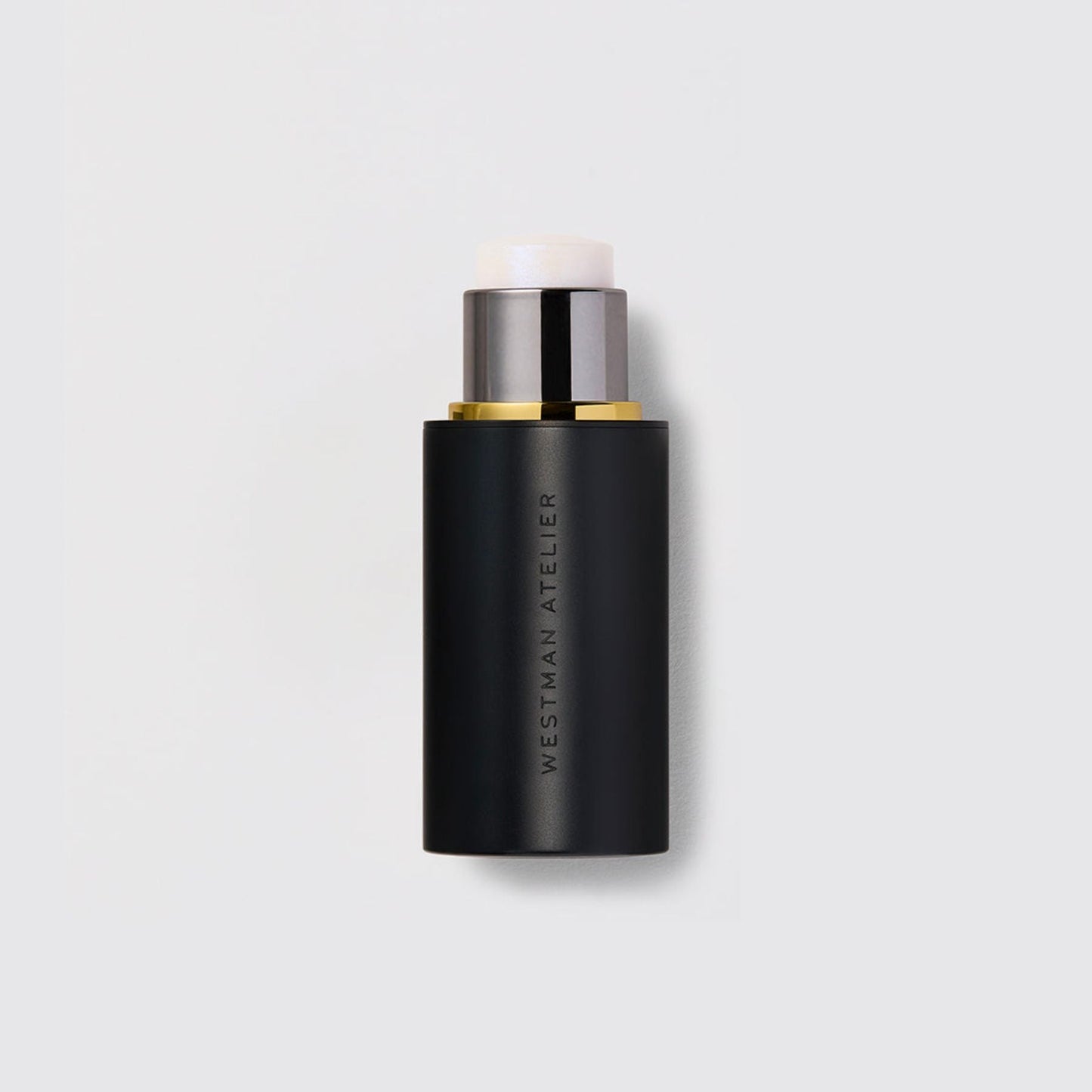 Westman Atelier Highlight Stick in a sleek black tube for a luminous glow and versatile makeup application