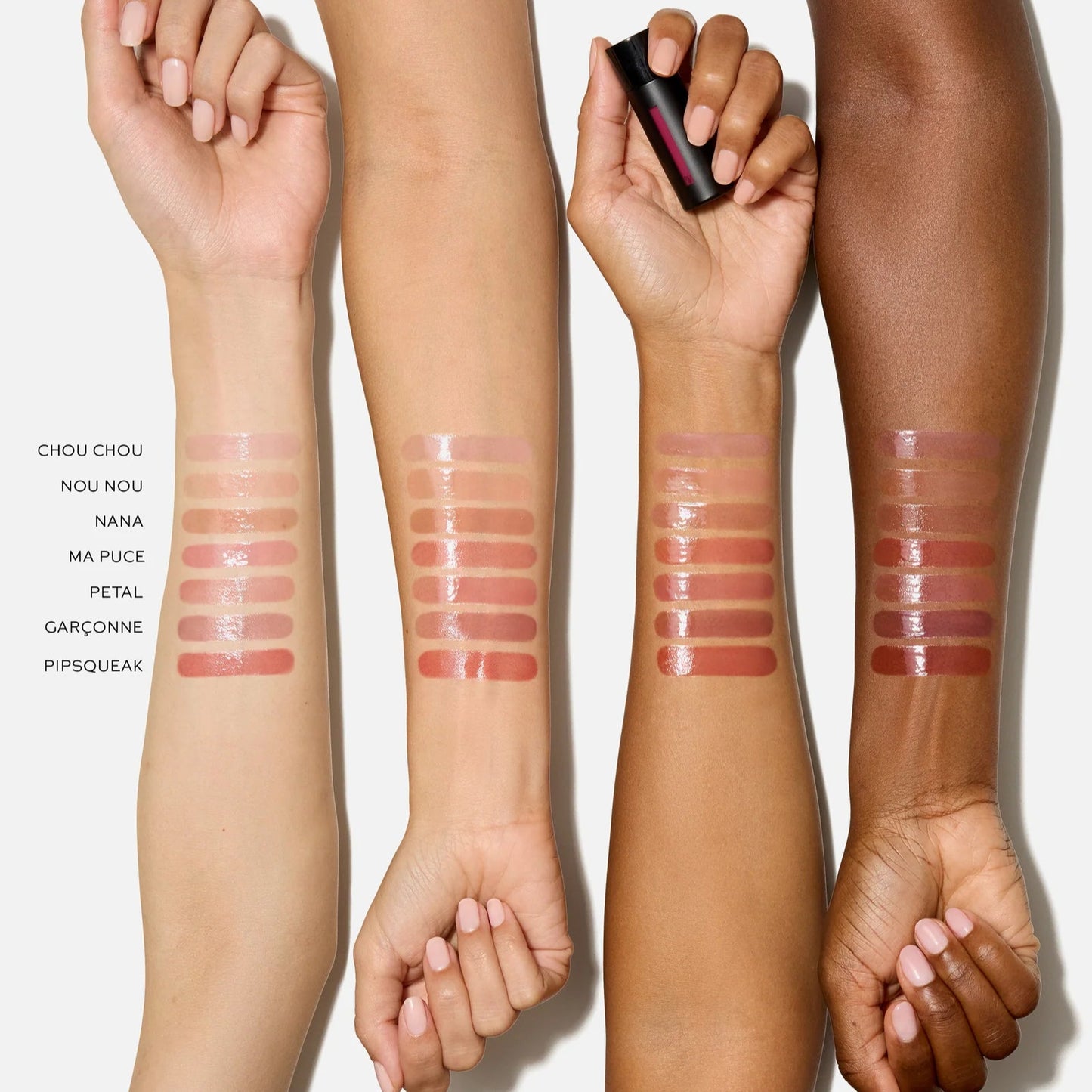 Swatch of Westman Atelier Liquid Tinted Lip Balm shades on various skin tones for versatile lip color