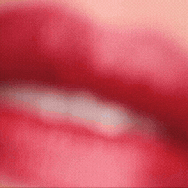 Close-up of lips wearing bold red lipstick representing Paris At 7pm by Madame Gabriela