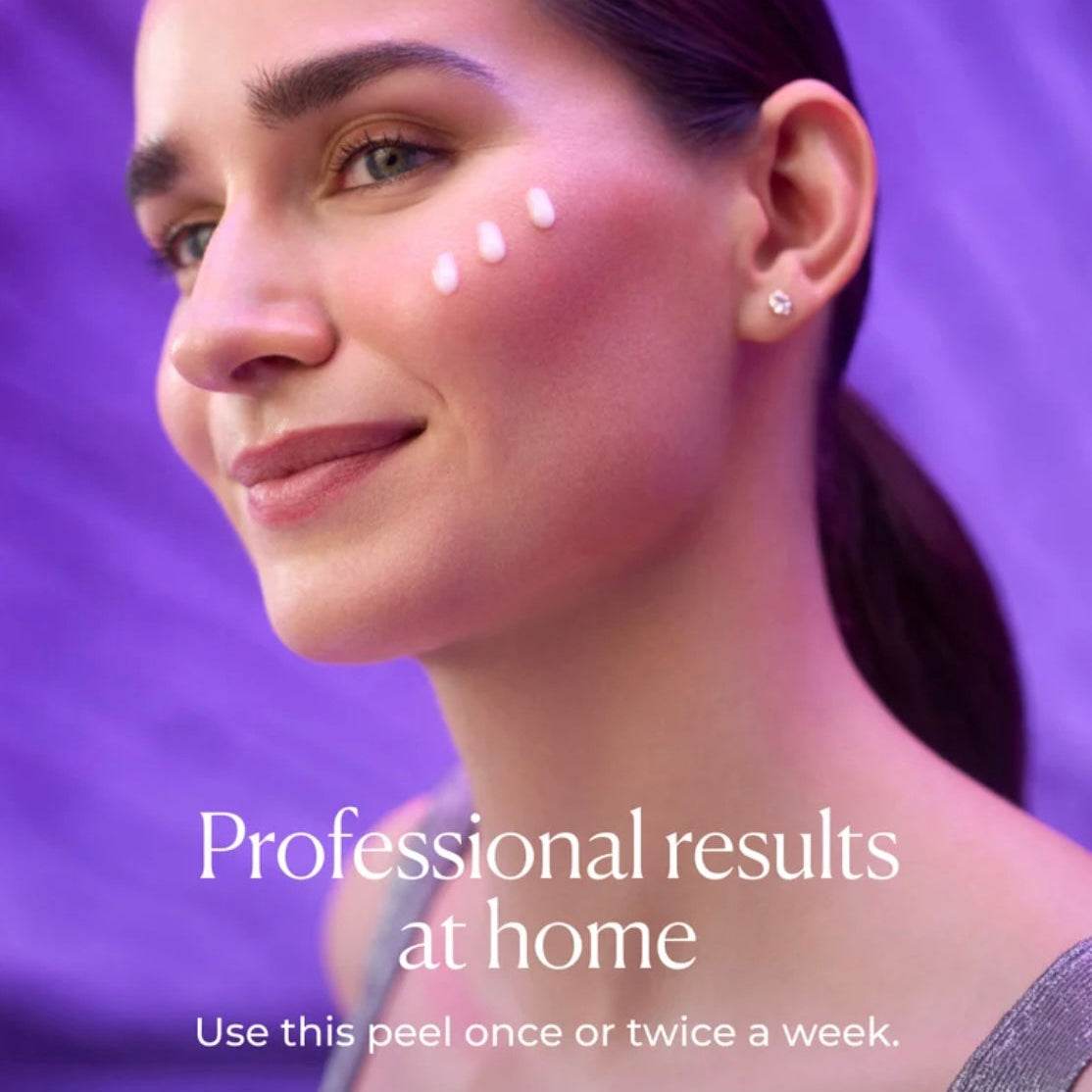 Woman applying Natura Bisse Diamond Glyco Extreme Peel Advanced Rejuvenating Exfoliant on her cheek