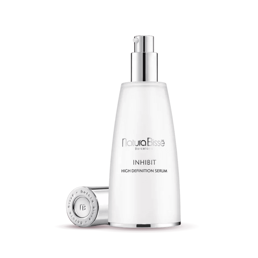 Natura Bisse Inhibit High Definition Serum in sleek bottle, a rejuvenating firming serum for youthful skin
