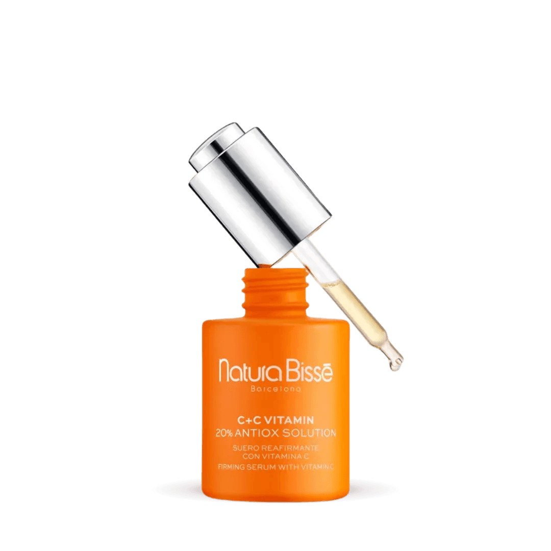 Natura Bisse Firming Serum with Vitamin C in orange bottle with dropper for brightening skin and reducing signs of aging