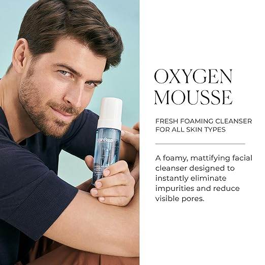 Natura Bissé Fresh Foaming Cleanser Oxygen Mousse held by smiling man with clear skin
