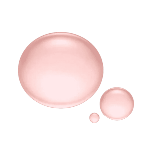 Natura Bissé Hydrating Revitalizing Essence shown in pink droplets on a black background
