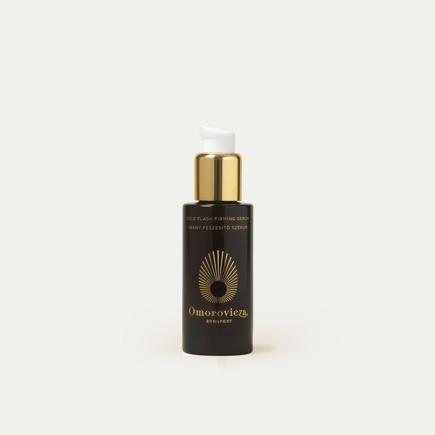 Omorovicza Firming Serum in a black bottle with gold accents for skin tightening and hydration