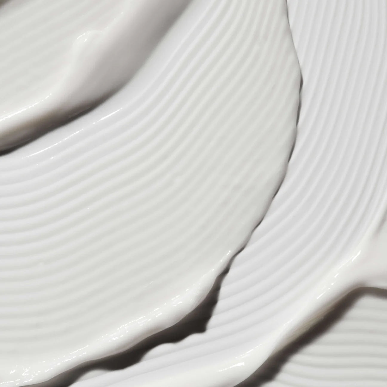 Close-up texture of Omorovicza Illuminating Moisturizer cream smooth on skin surface