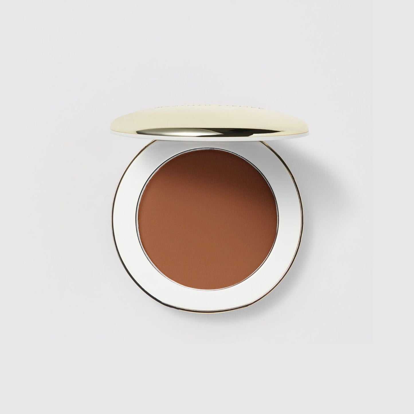 Westman Atelier Pressed Powder in a sleek compact, perfect for a flawless finish and easy application