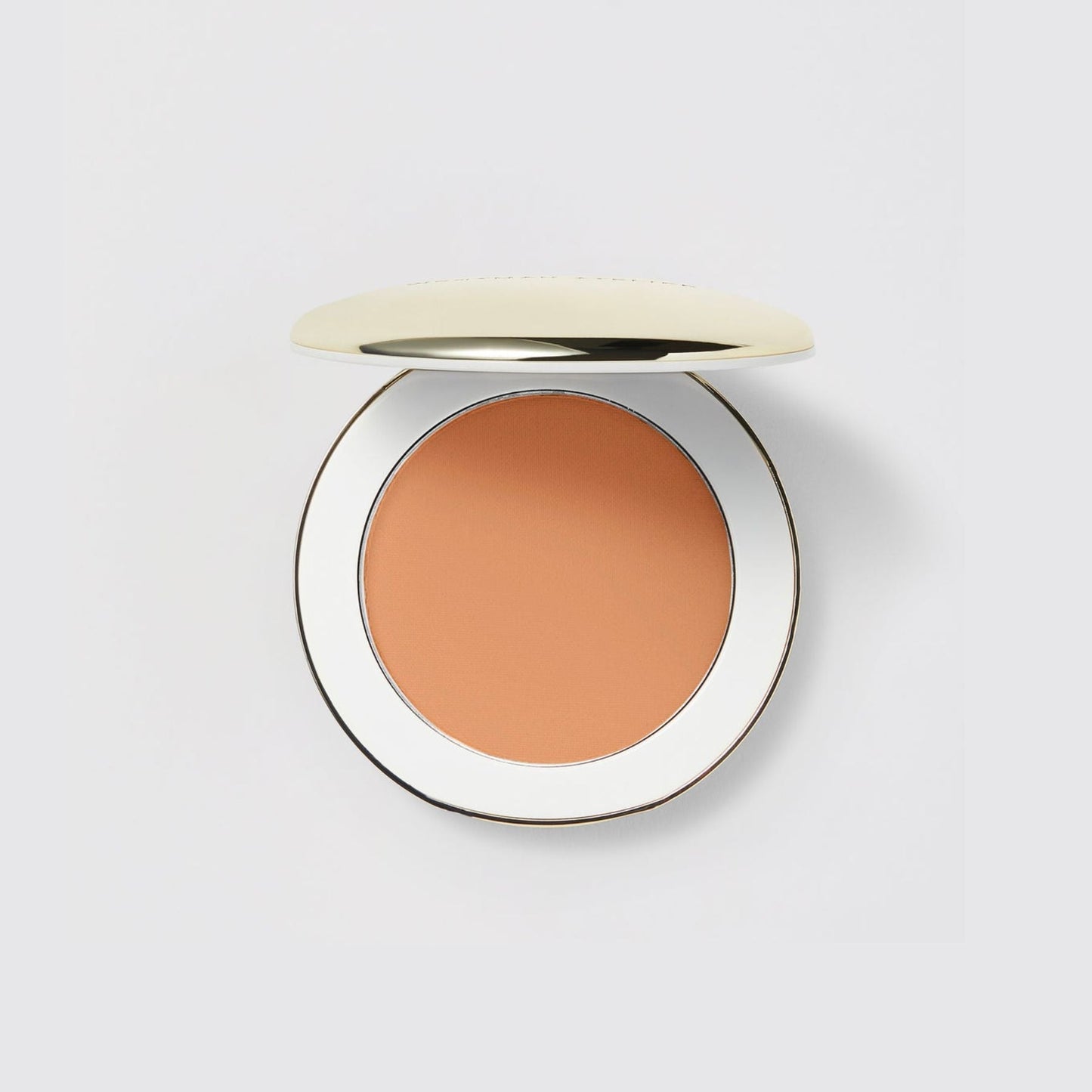 Westman Atelier Pressed Powder in a compact with a smooth, warm-toned finish for a flawless look