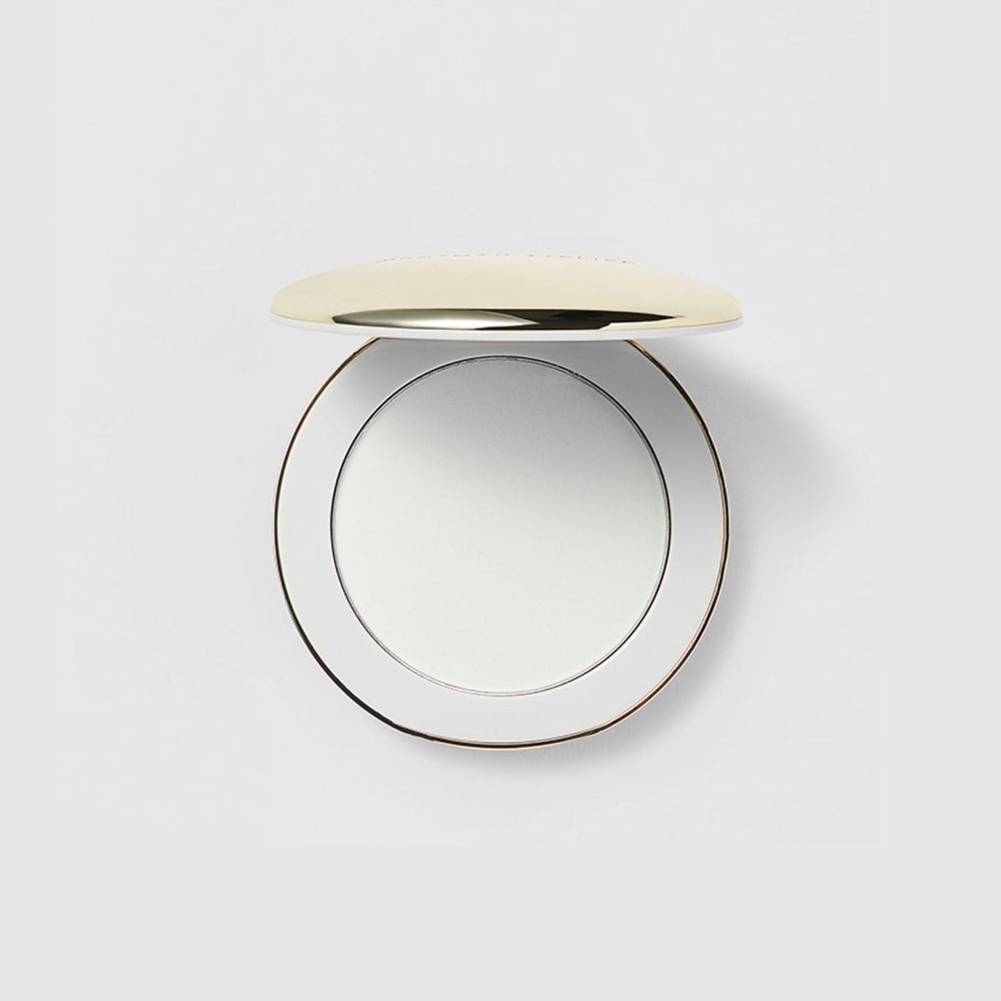 Westman Atelier Pressed Powder Compact with a Sleek Gold Lid for Flawless Skin Finish
