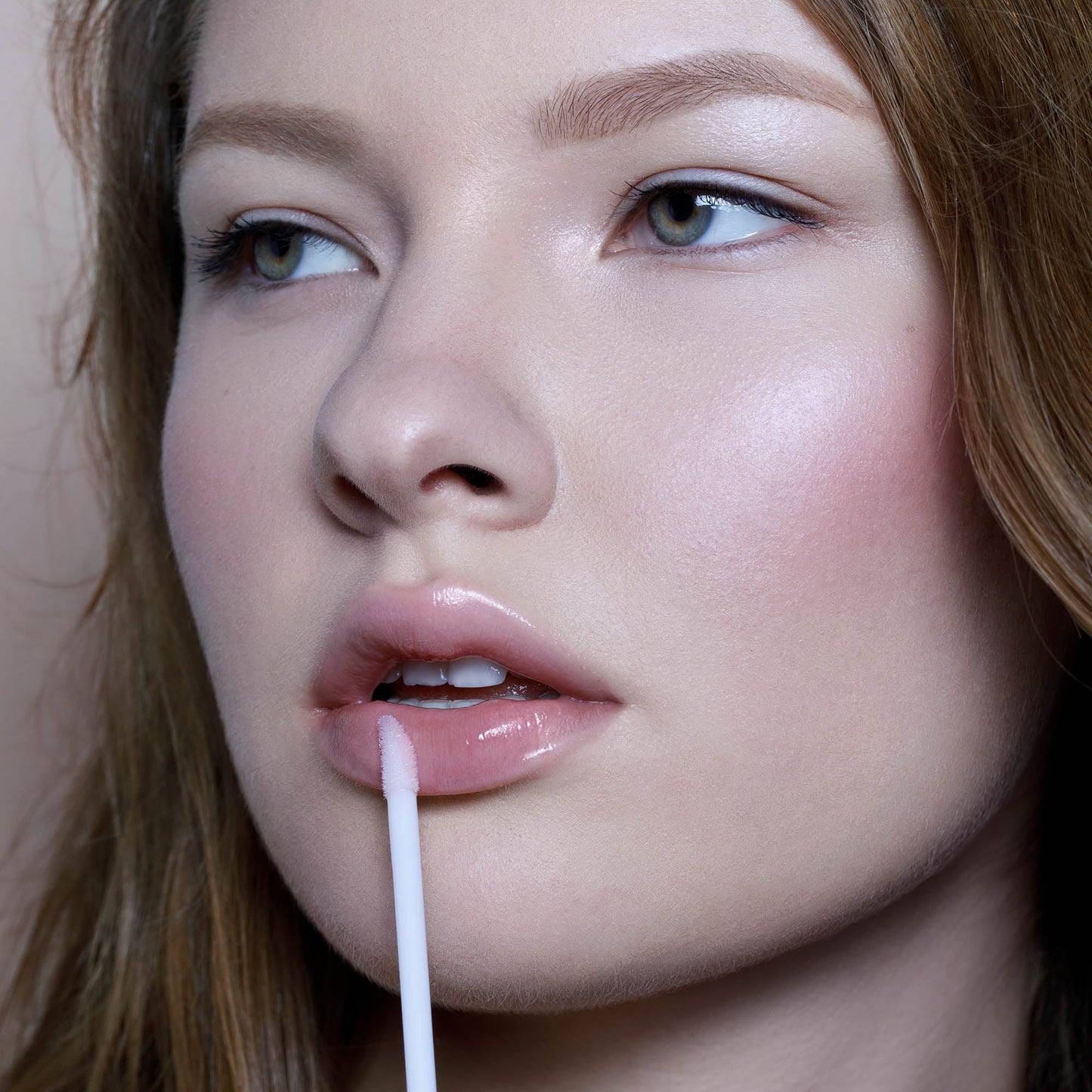 Rituel de Fille Lip Oil applied on lips for a glossy, hydrating finish