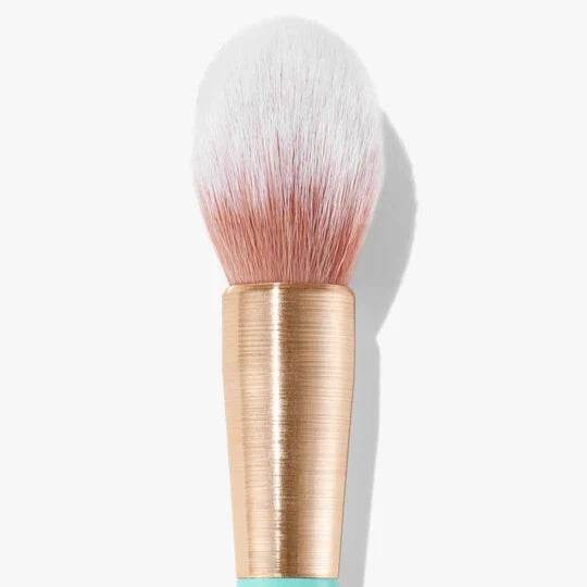 Sweed soft bristle powder brush with a stylish gold and teal handle for flawless makeup application