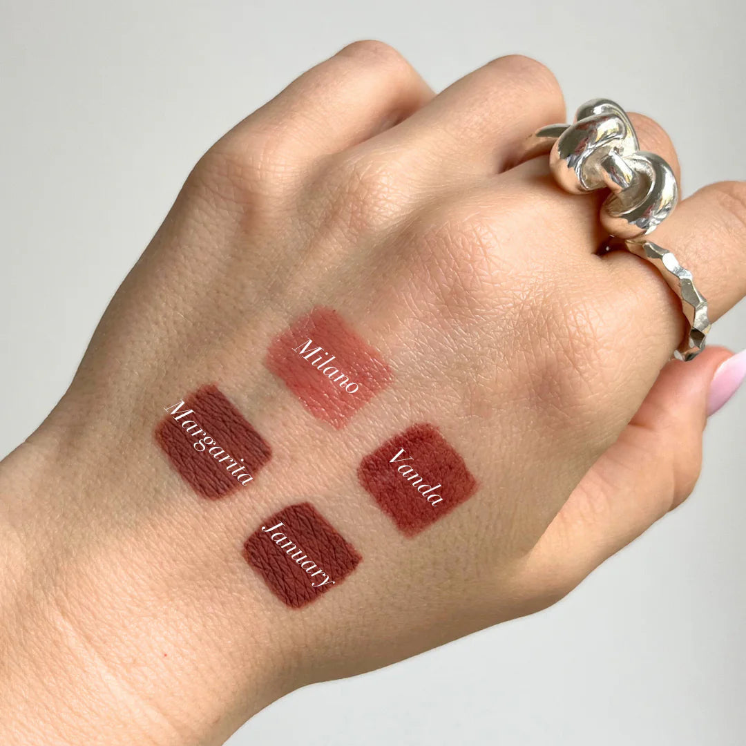 Sweed luxury lip crayon swatches on hand showcasing four shades: Milano, Margarite, January, and Verde