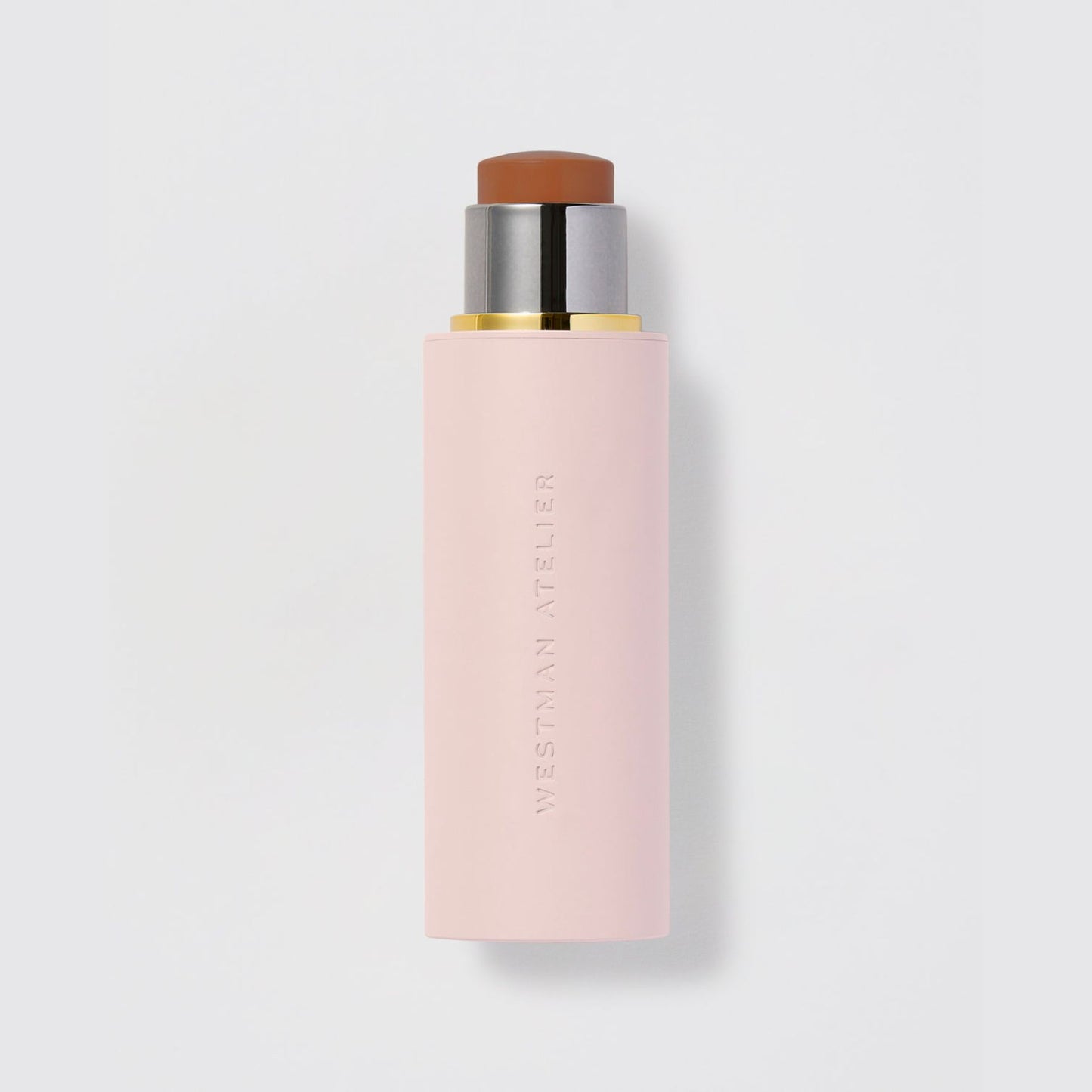 Westman Atelier Foundation Stick in a soft pink casing for seamless application and coverage