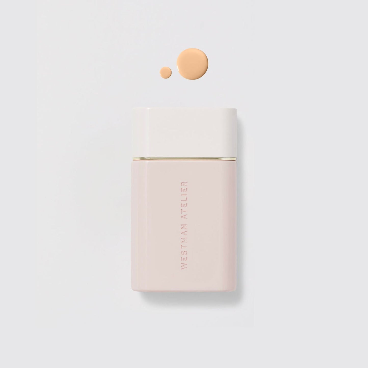 Westman Atelier Radiant Skin Tint in a sleek container with a drop of product showcasing its creamy texture