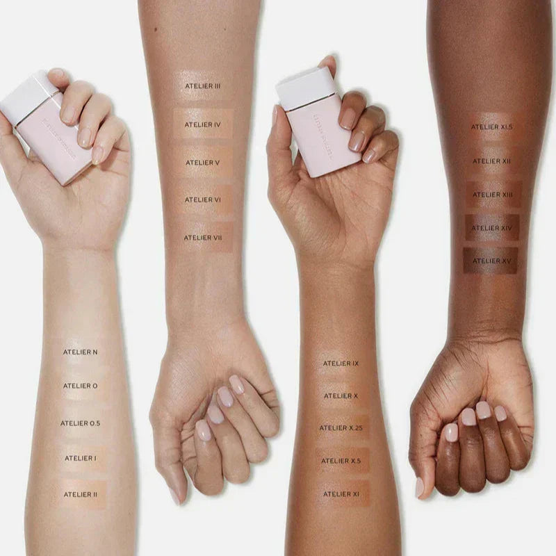Westman Atelier Radiant Skin Tint showing various shades swatched on different skin tones