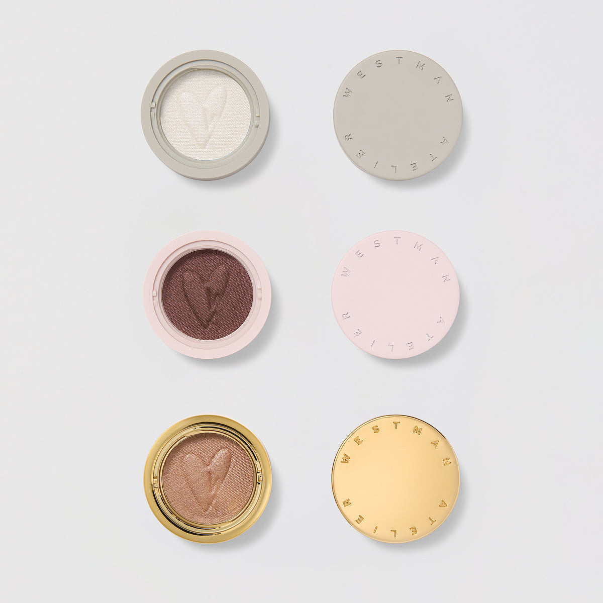 Westman Atelier Cream Eyeshadow in various shades, featuring heart imprints on the surface