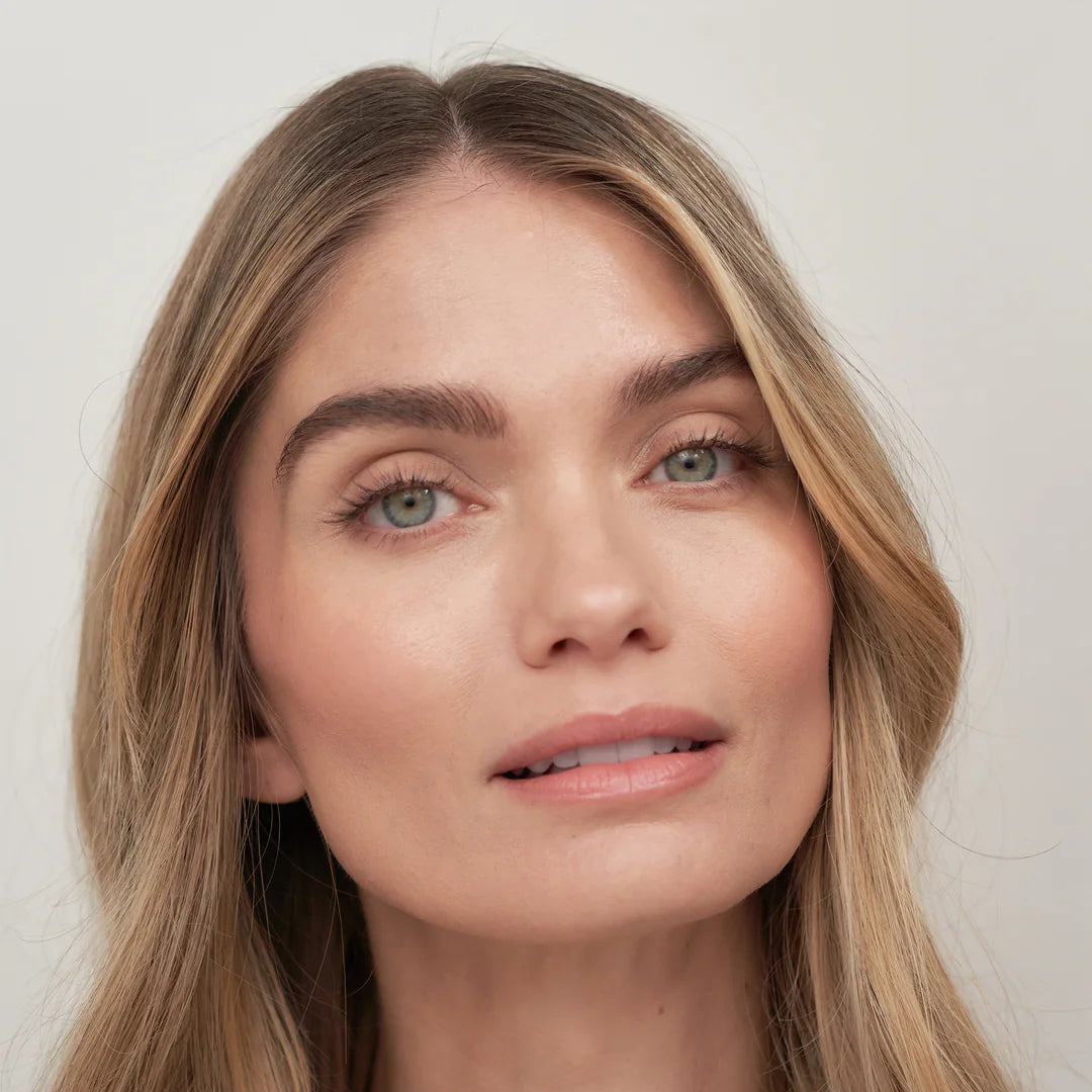 Close-up of a woman with text overlay about makeup products.