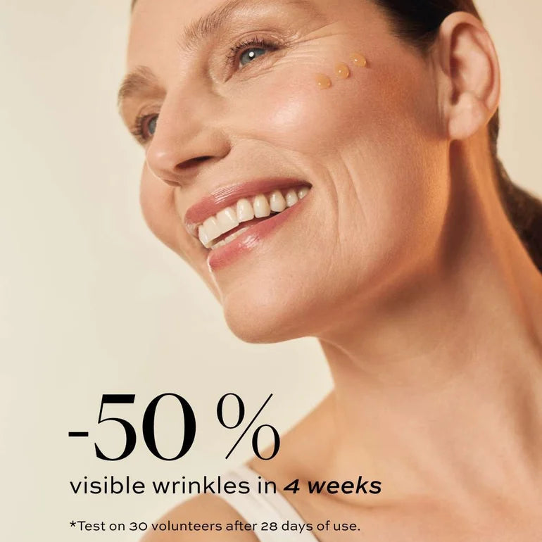 Advertisement for skin care product showing a woman's face with text about visible wrinkles reduction.