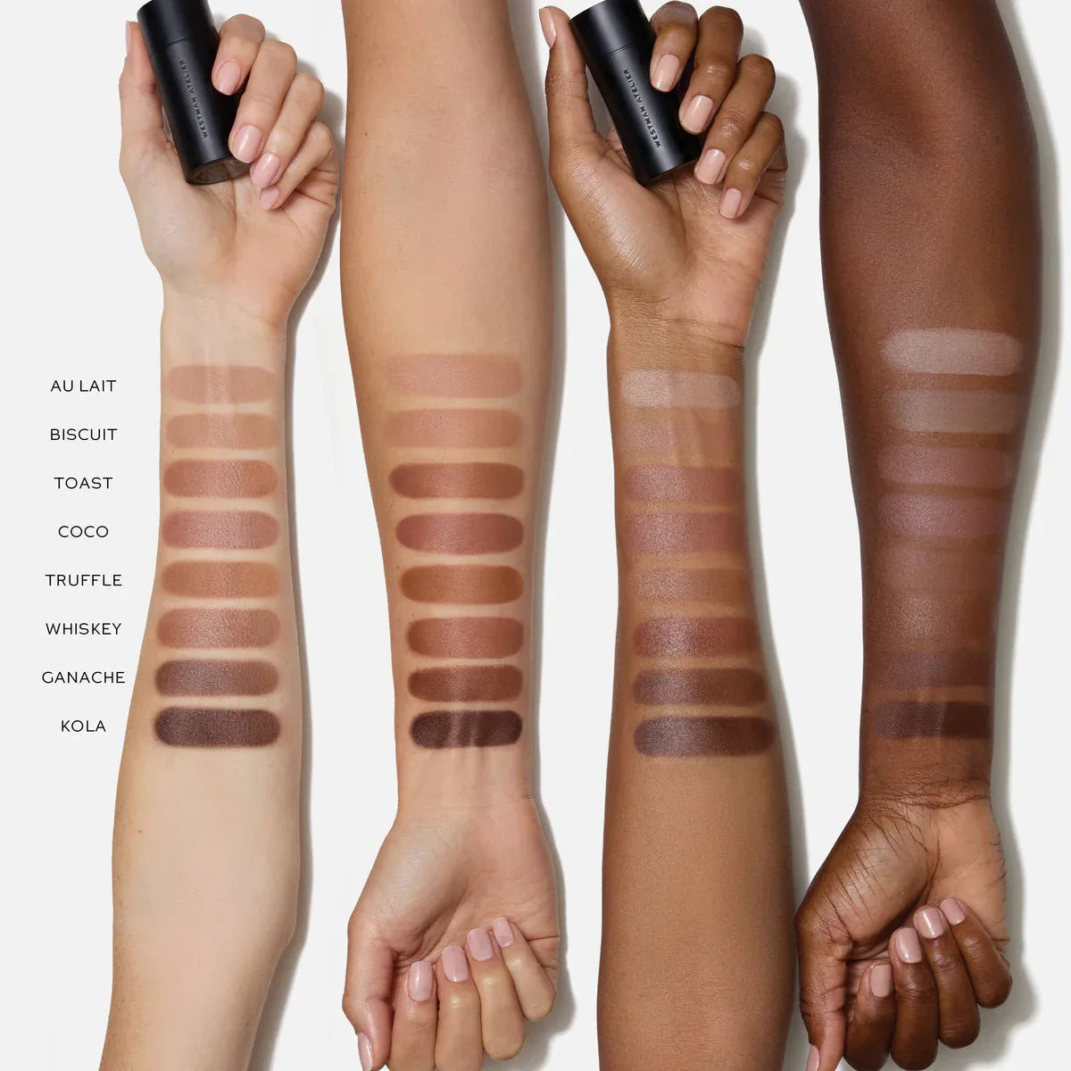 Four arms with different skin tones displaying makeup swatches on a white background.