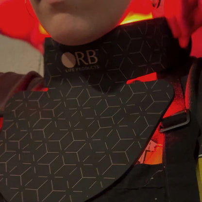 Person wearing a black geometric-patterned product with 'ORB' branding.