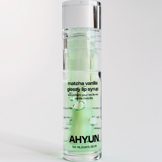 AHYUN matcha vanilla lip gloss in clear pump bottle with mint green serum and silver cap