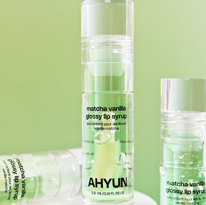 AHYUN matcha vanilla lip gloss glossy syrup tube in translucent green with brand logo