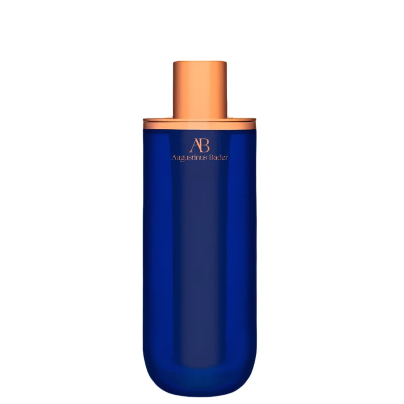Augustinus Bader The Serum in a sleek blue bottle with a gold cap for radiant skin