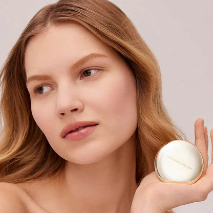 Westman Atelier Pressed Powder with a Natural Finish, modeled by a woman with soft features