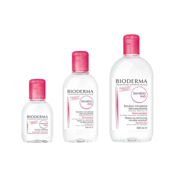 Three sizes of Bioderma Sensibio H2O Micellar Water bottles with pink caps for sensitive skin cleansing