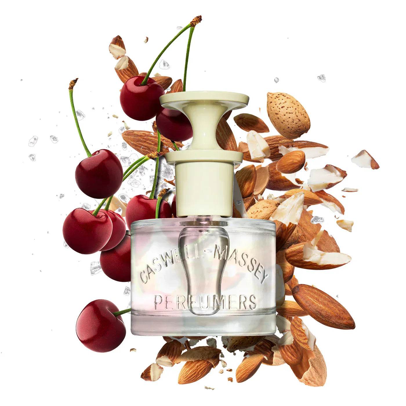 Caswell-Massey Almond Eau de Toilette bottle surrounded by fresh cherries and almonds