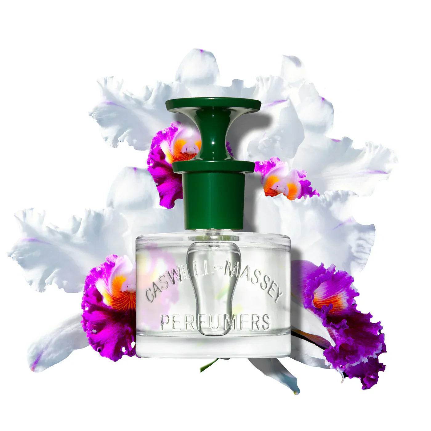 Caswell-Massey Orchid Eau De Parfum bottle with green cap surrounded by white and purple orchid flowers