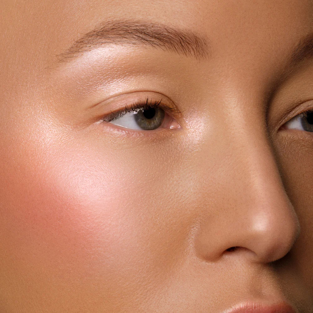 Rituel de Fille Cream Blush applied for a natural peachy glow on cheeks