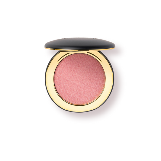 Westman Atelier cream highlight in soft pink shade with a luxurious gold case for radiant skin