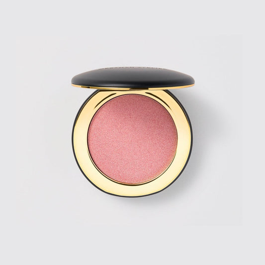 Westman Atelier Cream Highlight in a round compact with a pink shimmering shade