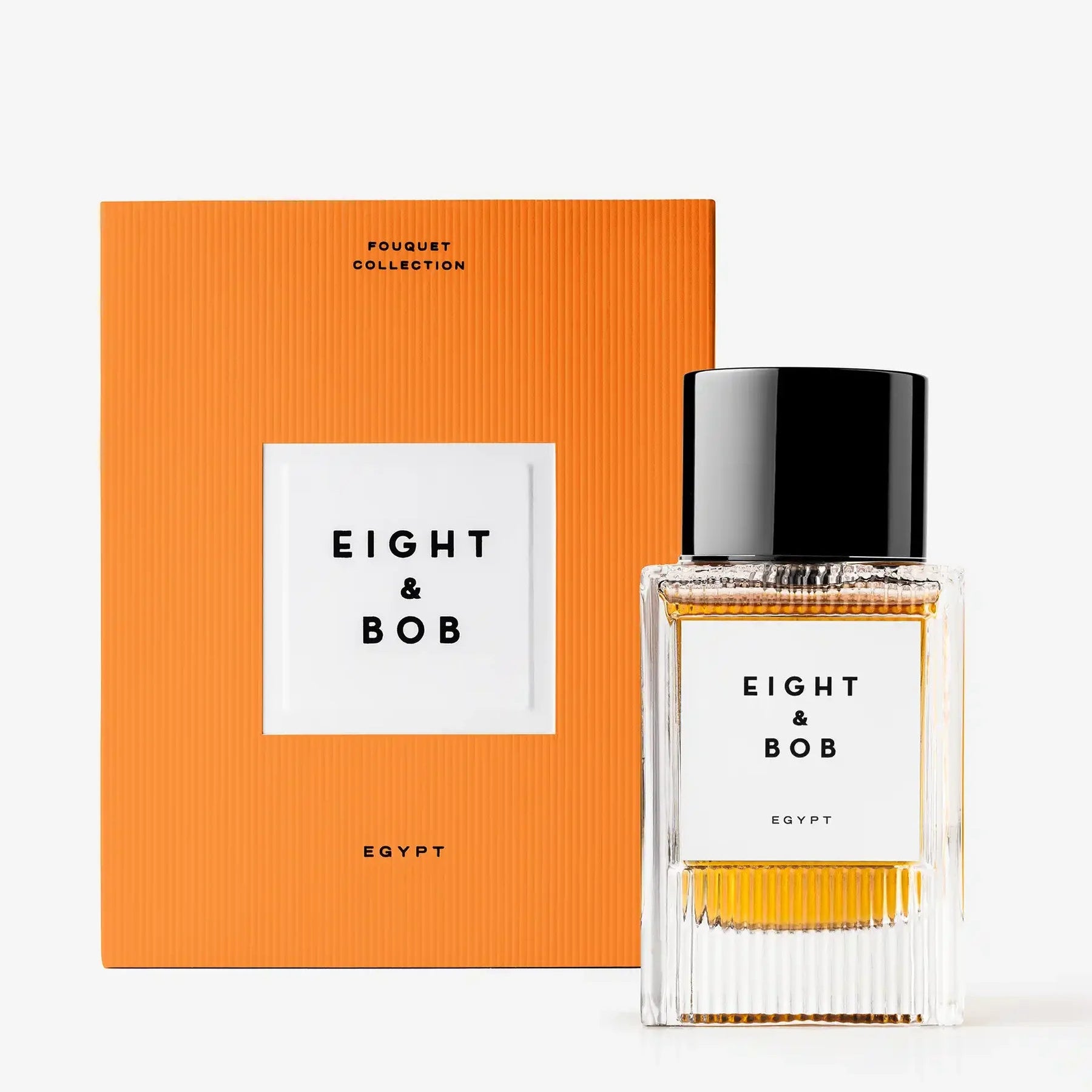 Eight & Bob perfume bottle with orange box on a white background