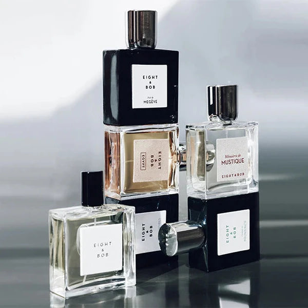 Eight & Bob perfume bottles including The Original fragrance in clear and black glass bottles