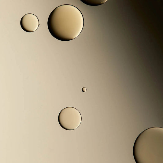 Omorovicza Facial Oil in a close-up view showing smooth, luxurious oil droplets
