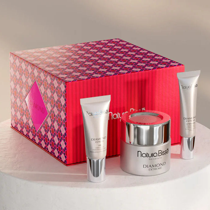 Cosmetic set with a red patterned box on a neutral background