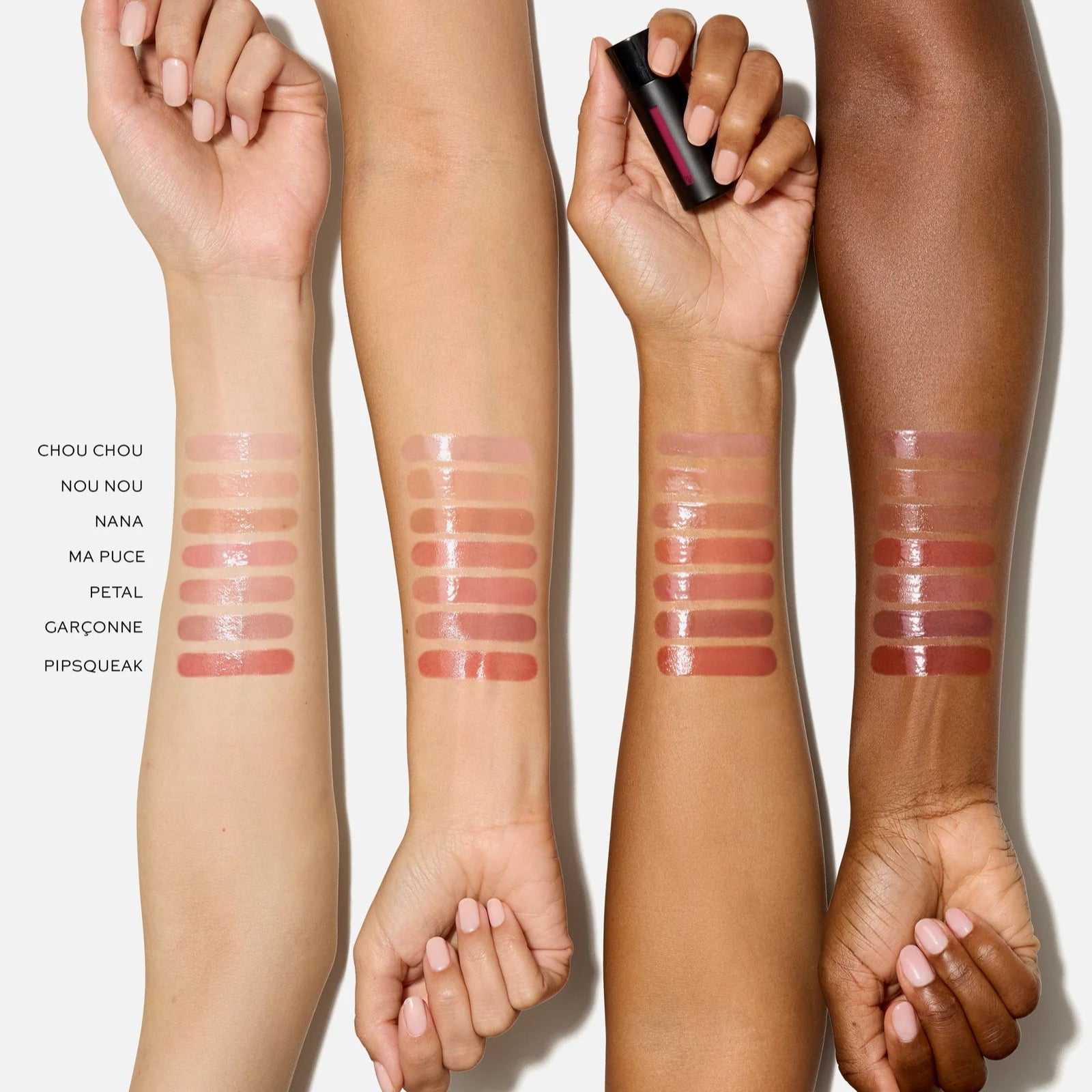 Swatch of Westman Atelier Liquid Tinted Lip Balm shades on various skin tones for versatile lip color