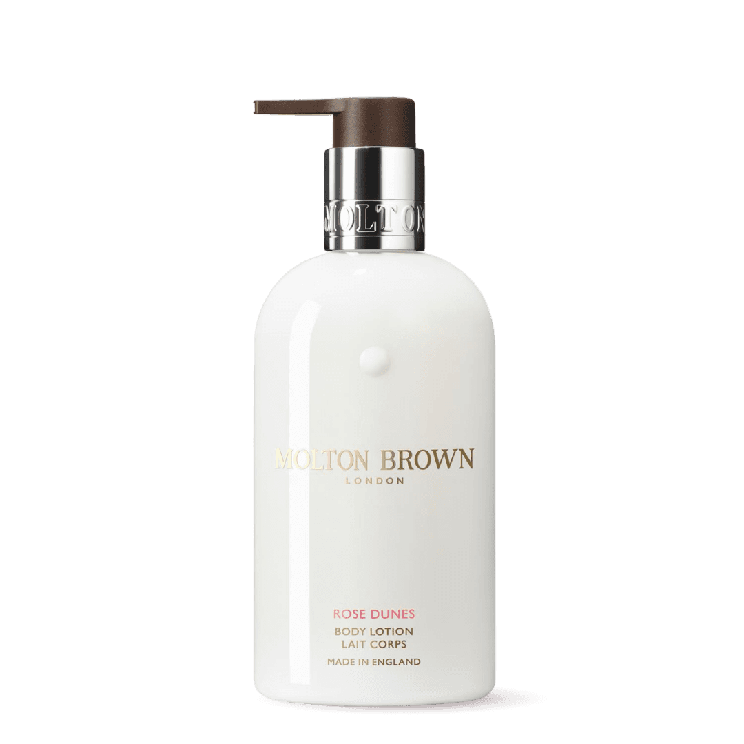 Molton Brown Rose Dunes Body Lotion in a sleek white bottle with a pump for hydration