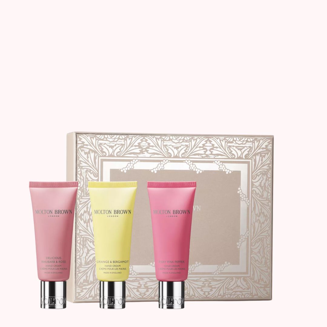 Molton Brown floral and spicy hand cream set featuring rose, orange, and bergamot scents in travel-sized tubes