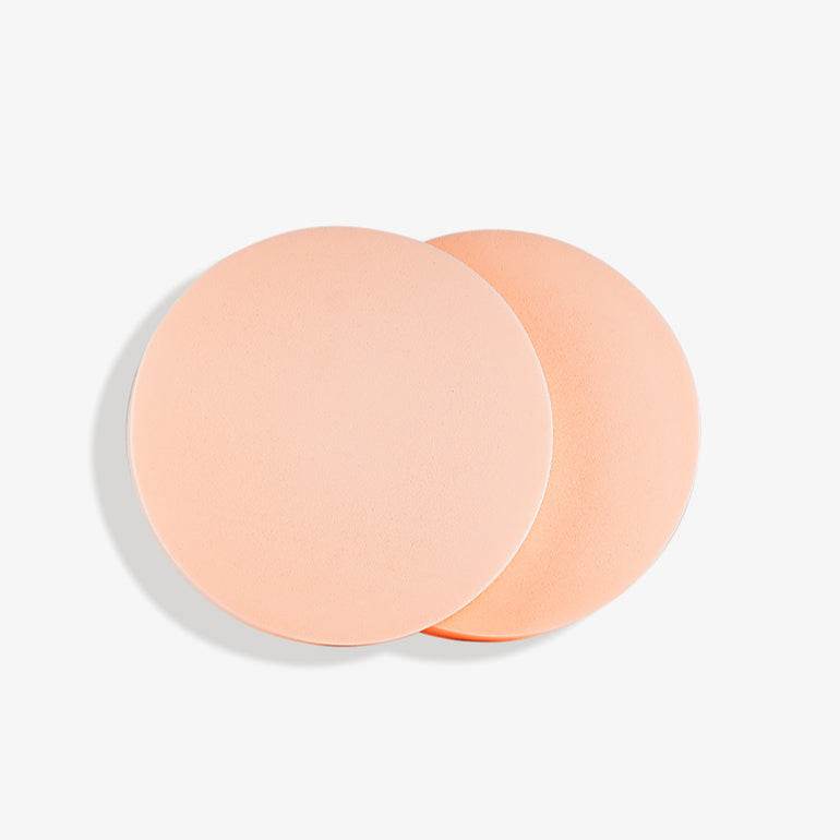 Natura Bissé best facial cleansing sponges in peach color for gentle skin care and cleansing