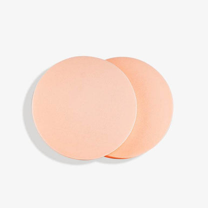Natura Bissé best facial cleansing sponges in peach color for gentle skin care and cleansing