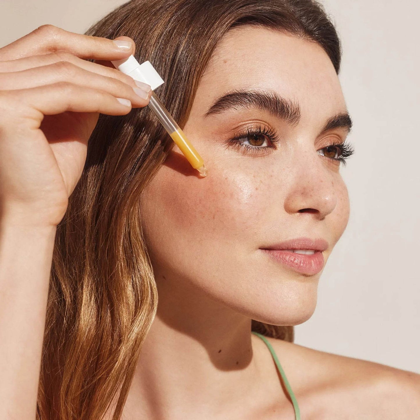 Natura Bissé Blemish, Oil, and Pore Control Serum being applied to skin for a clear complexion